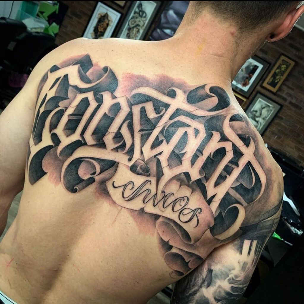 Calligraphy tattoo on the back for men