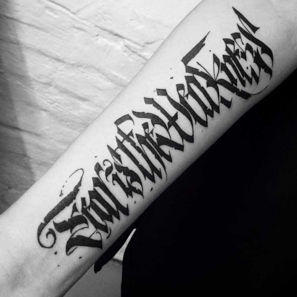 Calligraphy tattoo on forearm for men