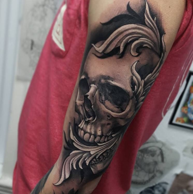 Baroque skull tattoo on the shoulder for men