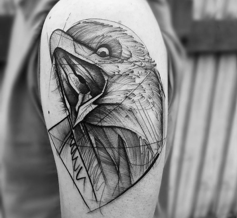 Graphic style tattoo on the shoulder for men