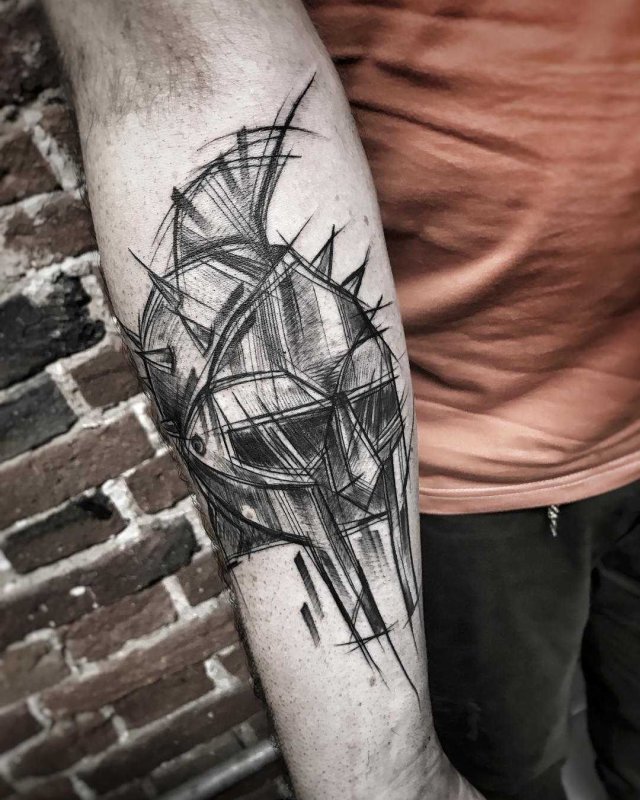 Graphic style tattoo on forearm for men