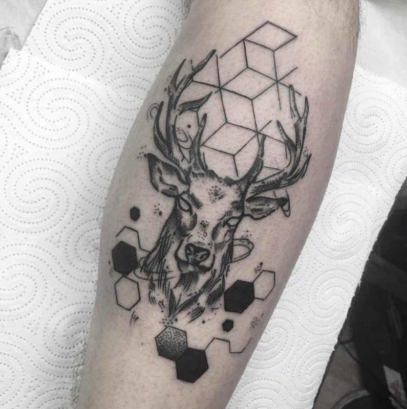 Tattoo of a deer in graphic style on the leg for men