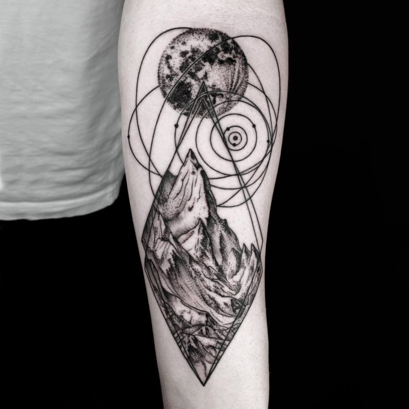 Graphic style mountain tattoo on forearm for men