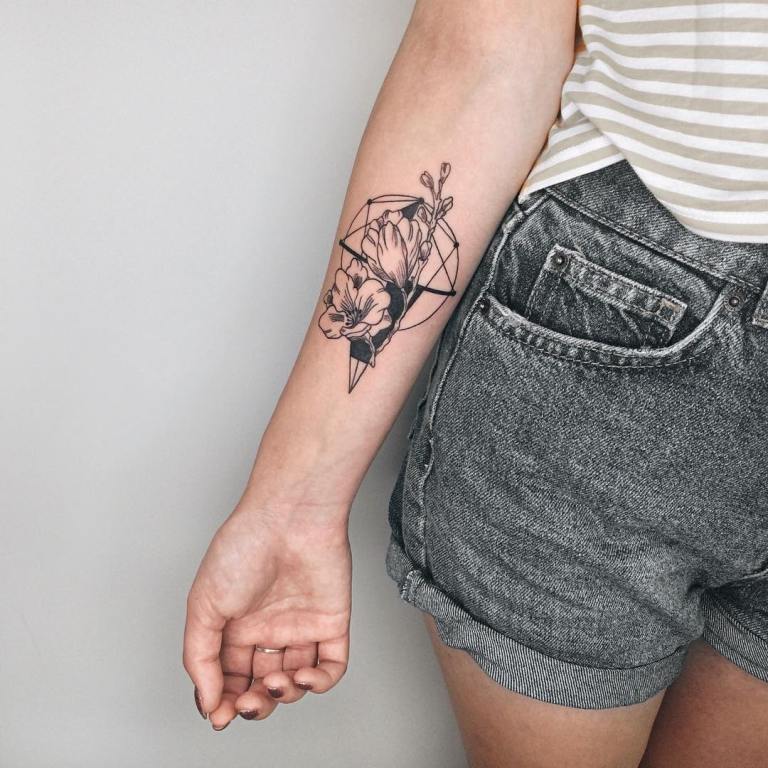 Flower tattoo on the arm for women