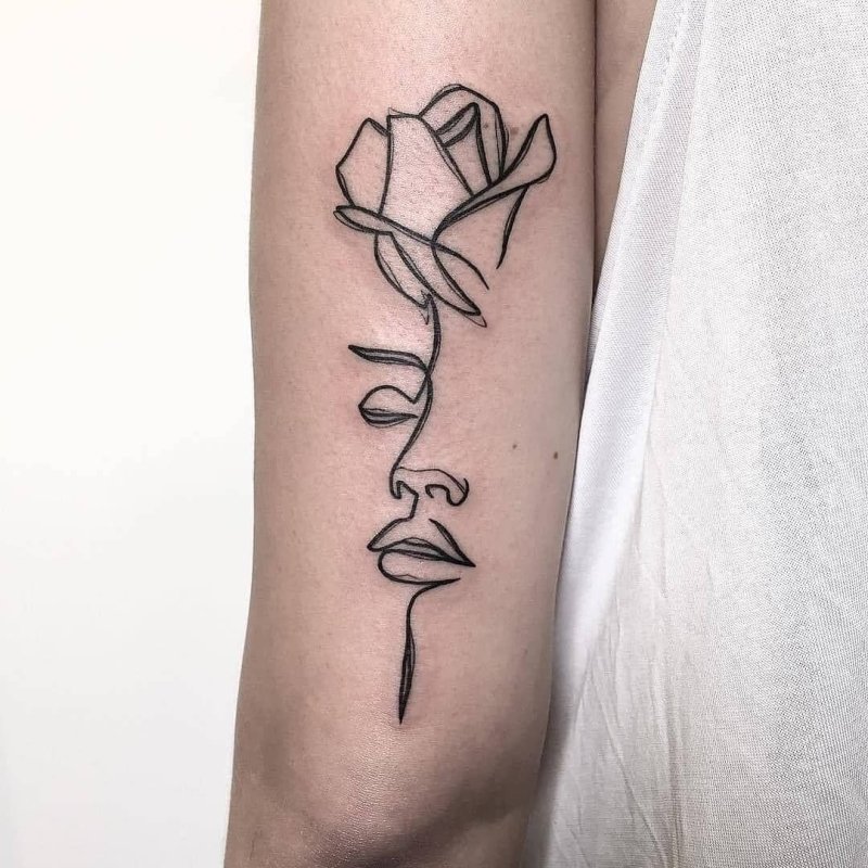 Tattoo of a rose and a girl on the arm for women