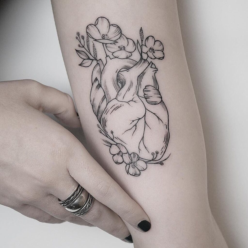 Heart tattoo on the arm for women