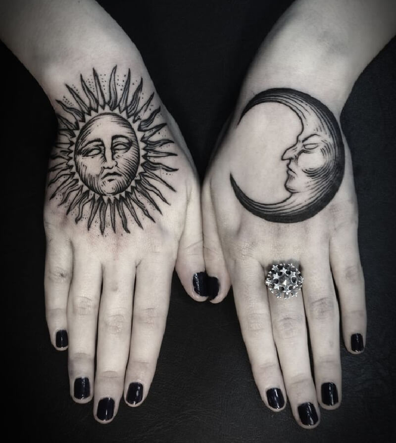 Large sun and moon tattoo on the brush for women