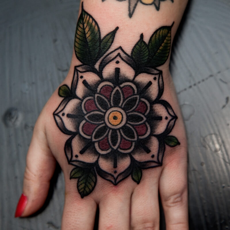 Rose tattoo on the hand for women