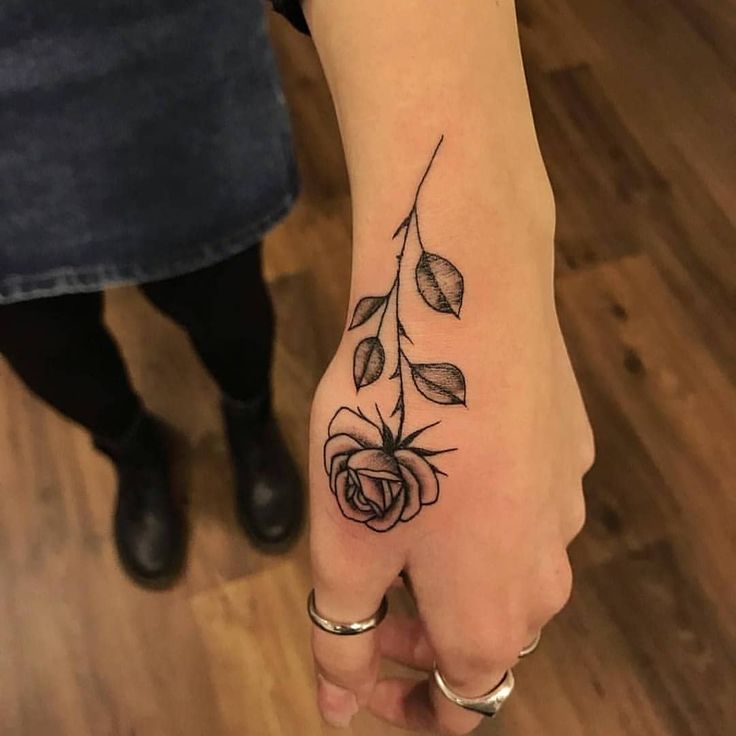 Rose tattoo on the hand for women