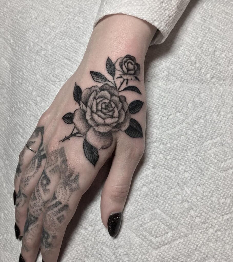 Rose tattoo on the hand for women