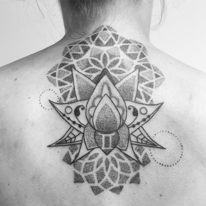 Dotwork tattoo on the back for women