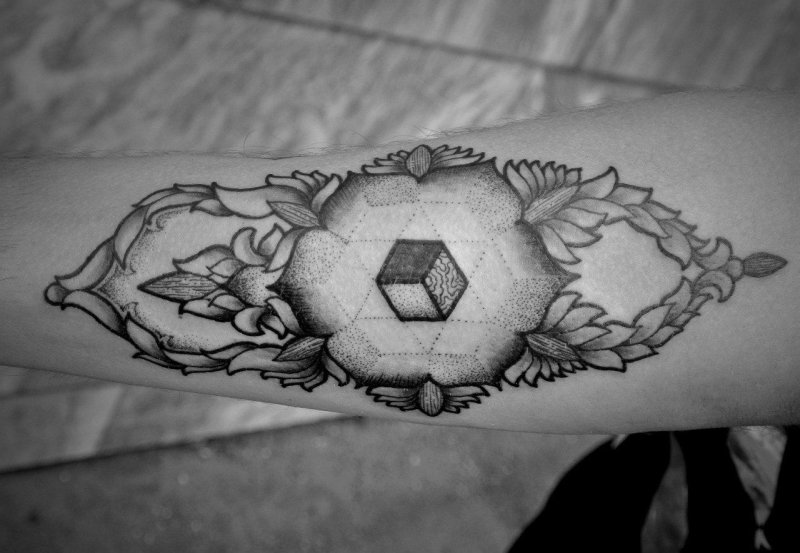 Tattoo in dotwork style on the forearm for men