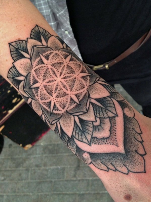 Tattoo in dotwork style on the forearm for women