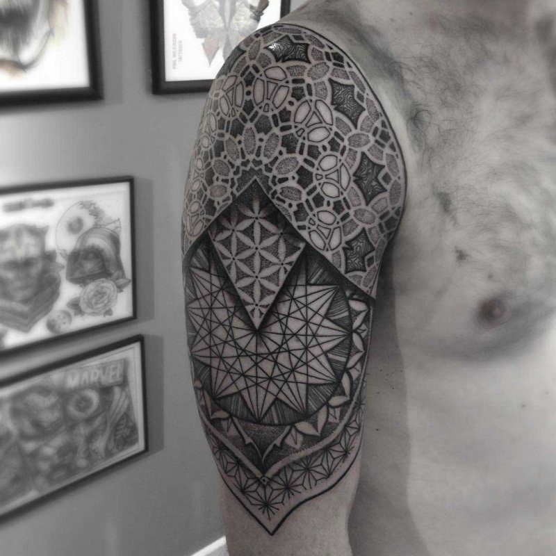 Tattoo in dotwork style on the shoulder for men