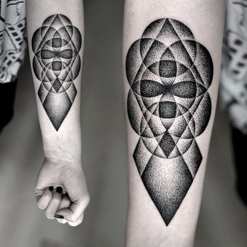 Large dotwork-style tattoo on the arm for women