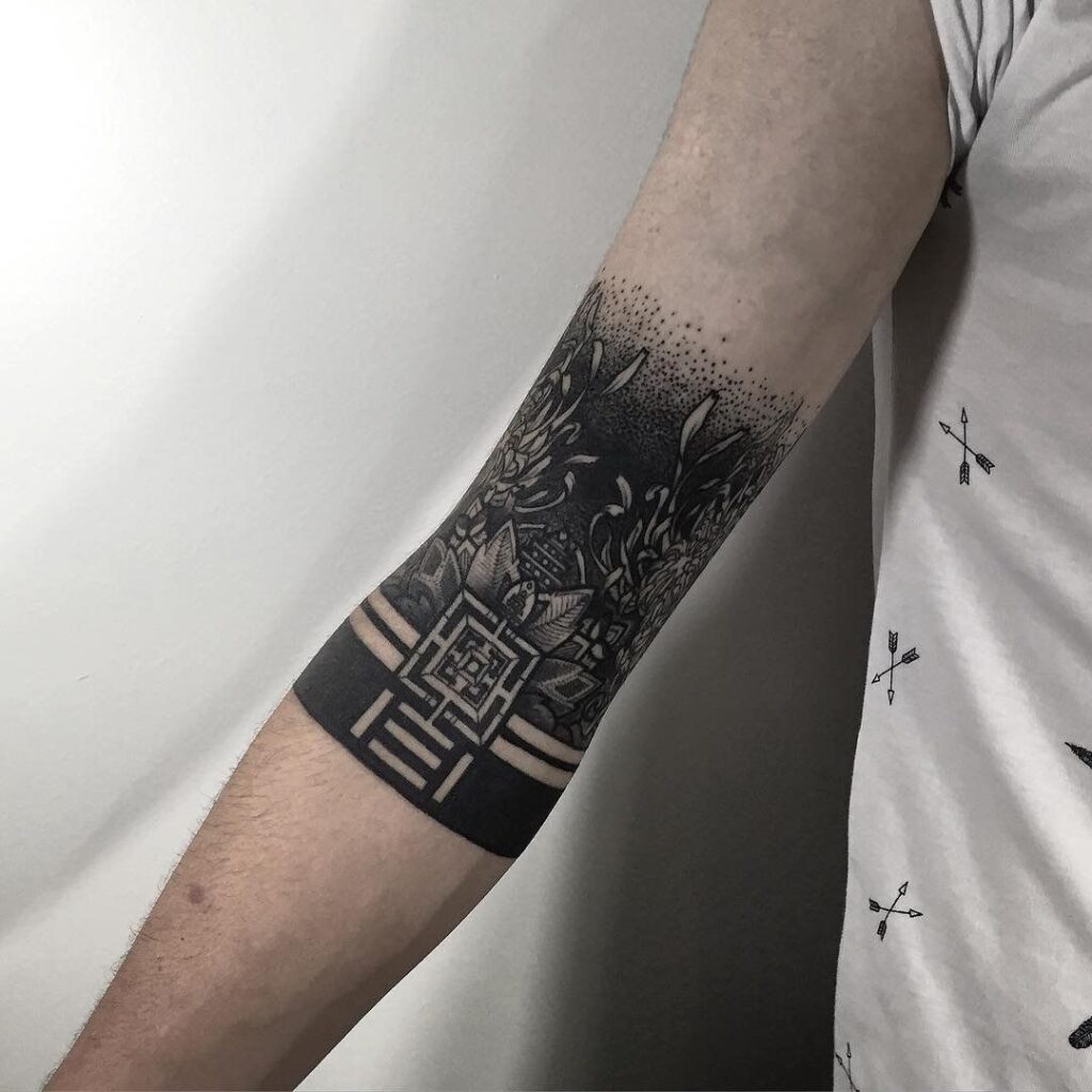 Blackwork style tattoo on the forearm for men