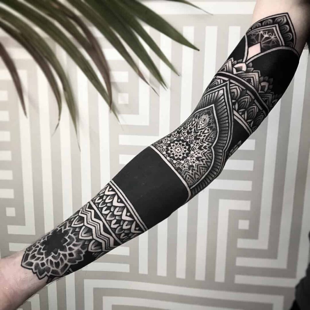 Blackwork tattoo on the arm for men