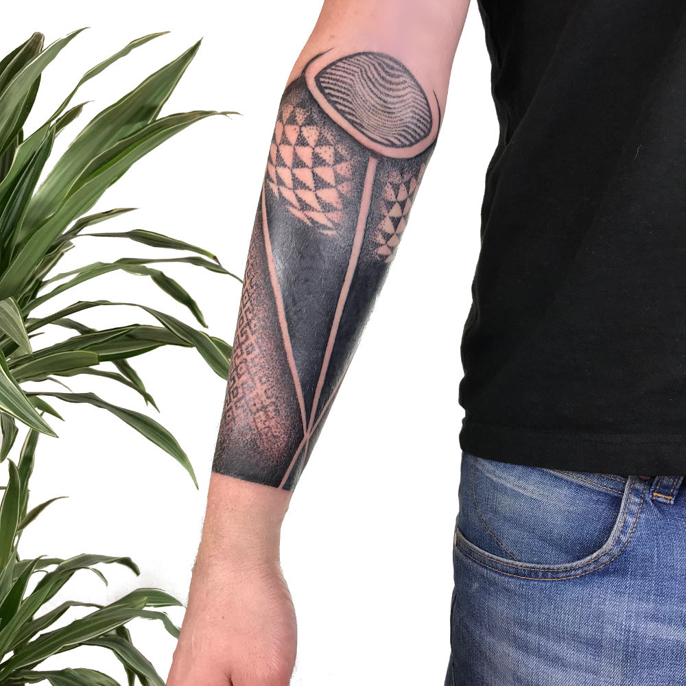 Blackwork tattoo on the forearm for men