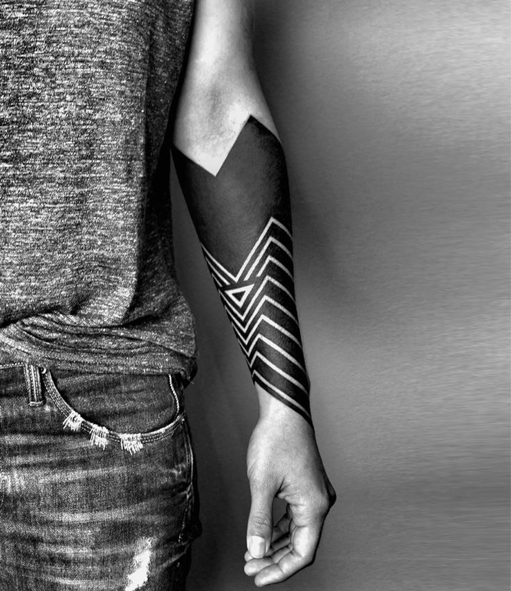 Blackwork tattoo on the forearm for men