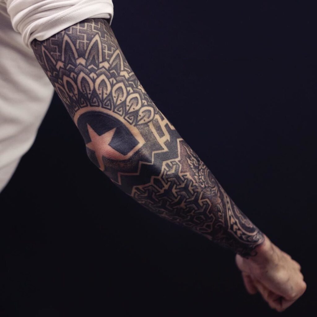 Blackwork tattoo on the arm for men