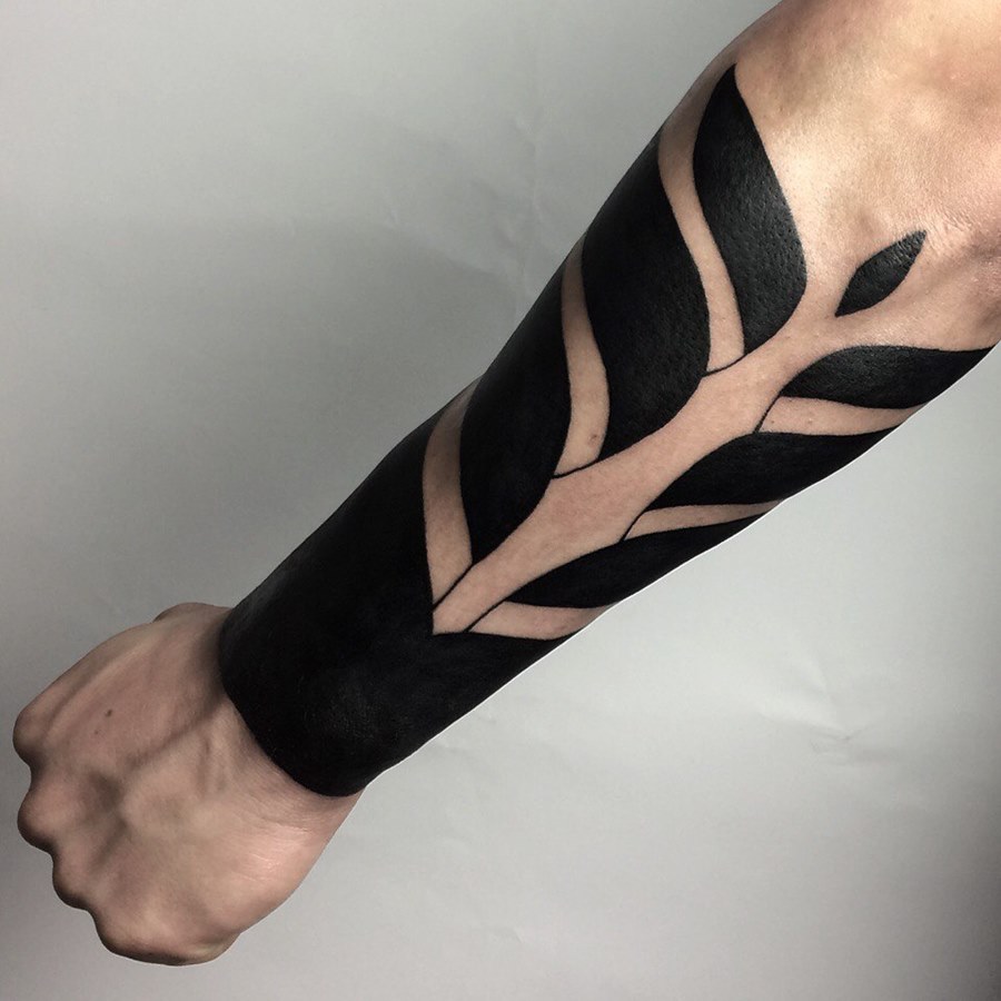 Blackwork tattoo on the forearm for men