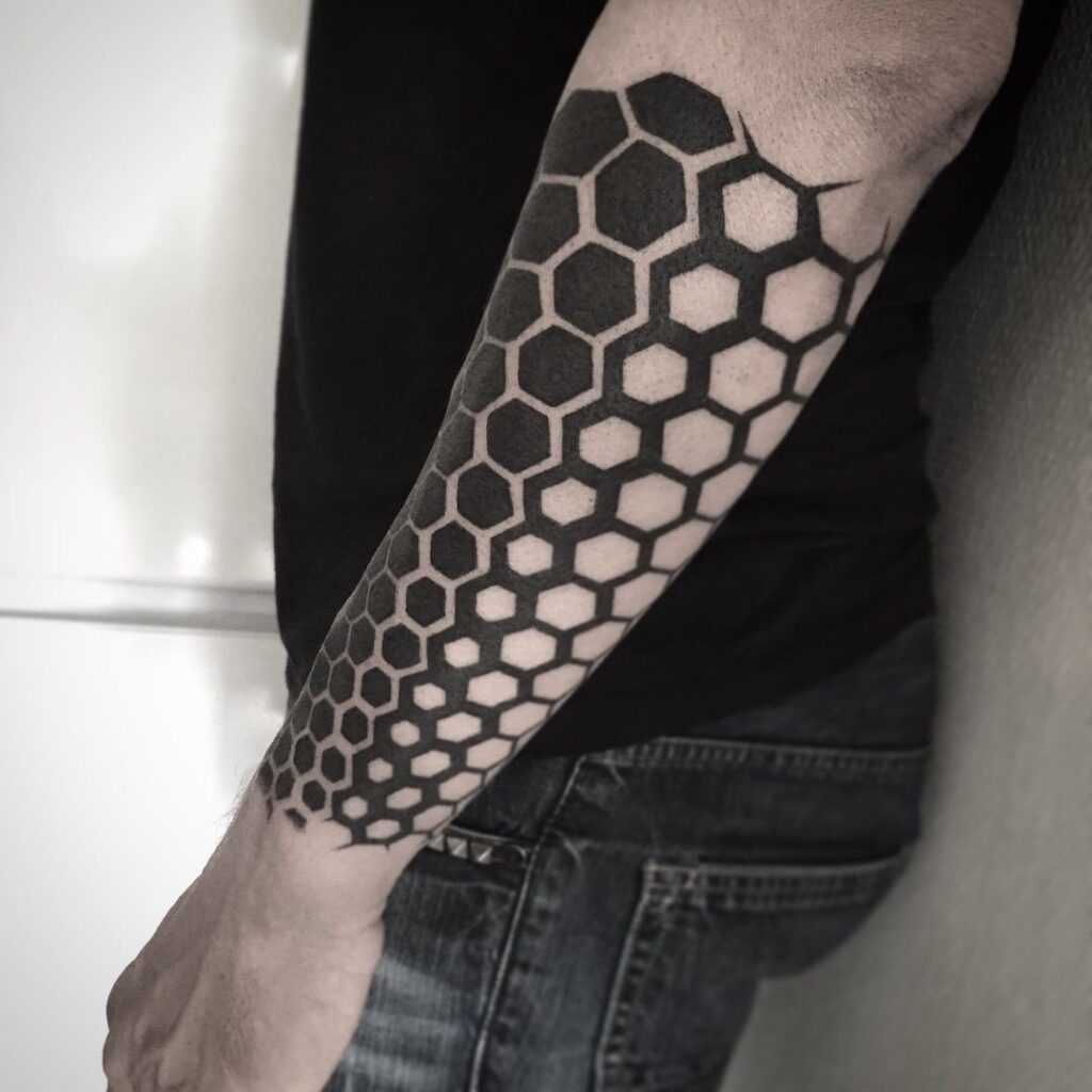 Blackwork tattoo on the forearm for men