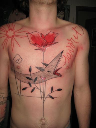 Art brut tattoo on the chest for men