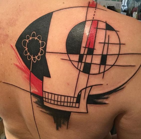 Art brut tattoo on the shoulder blade for men