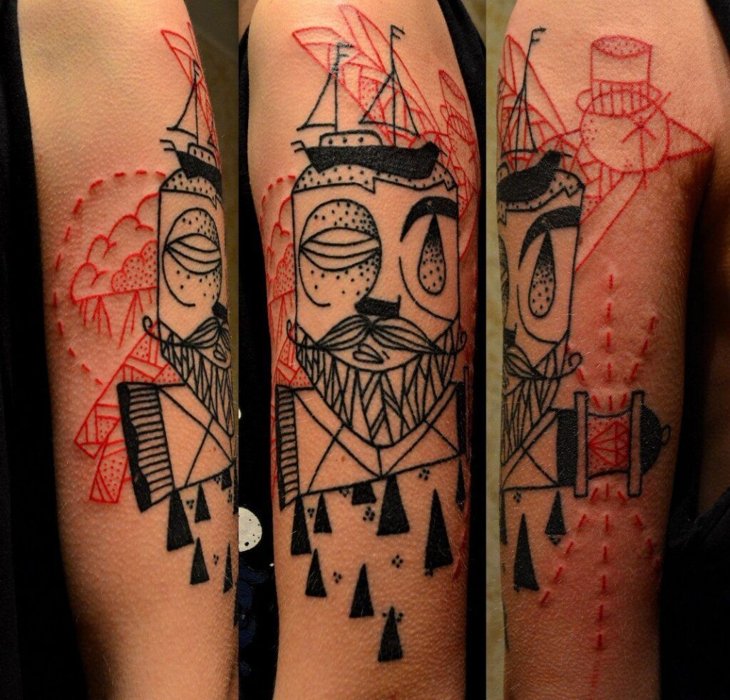 Art brut style tattoo on the shoulder for men