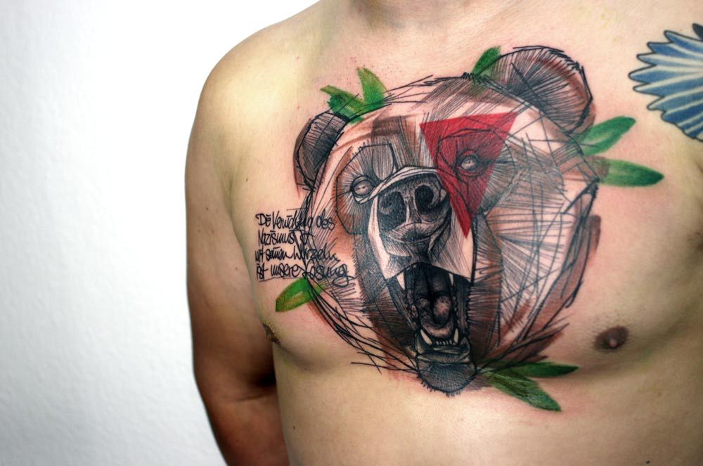 Tattoo of a bear in the style of art brut on the chest for men