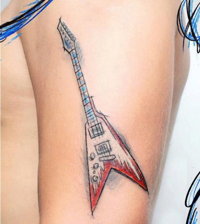 Art brut guitar tattoo on the thigh for women