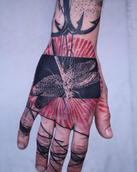 Art brut style tattoo on the hand for men