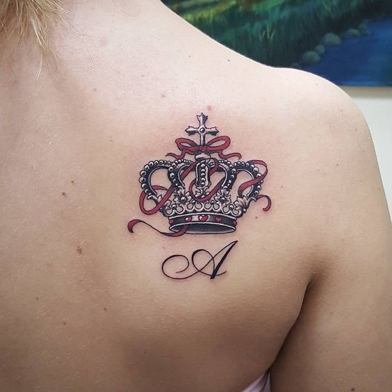 Crown tattoo on the shoulder blade for women