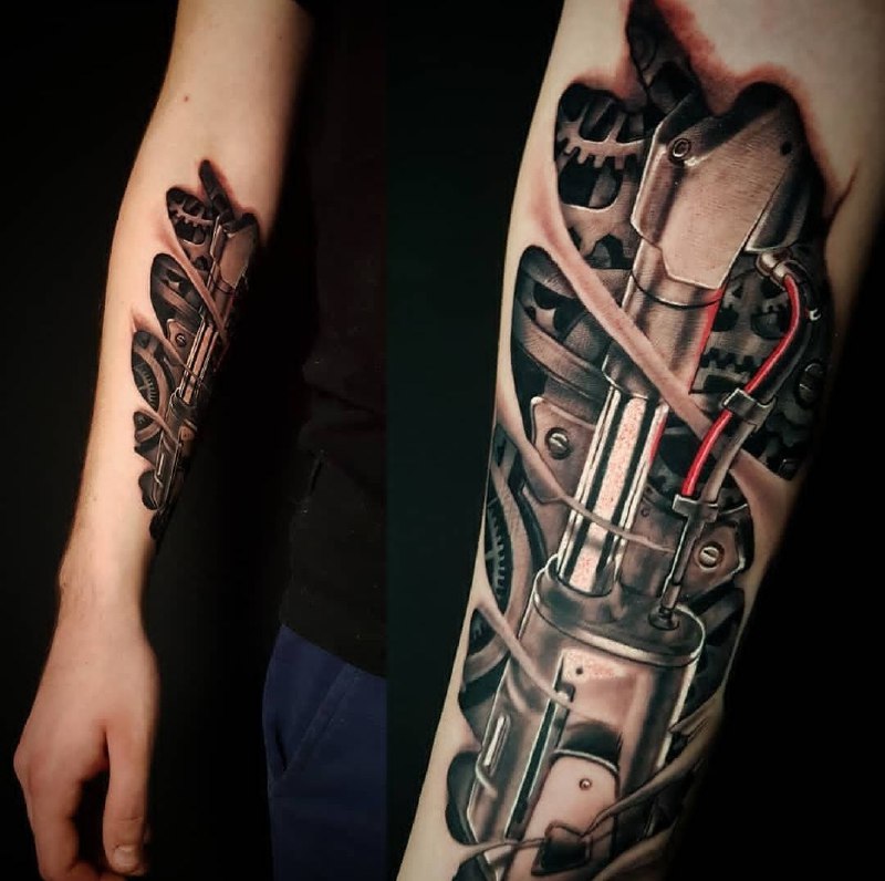 Biomechanics style tattoo on the forearm for men