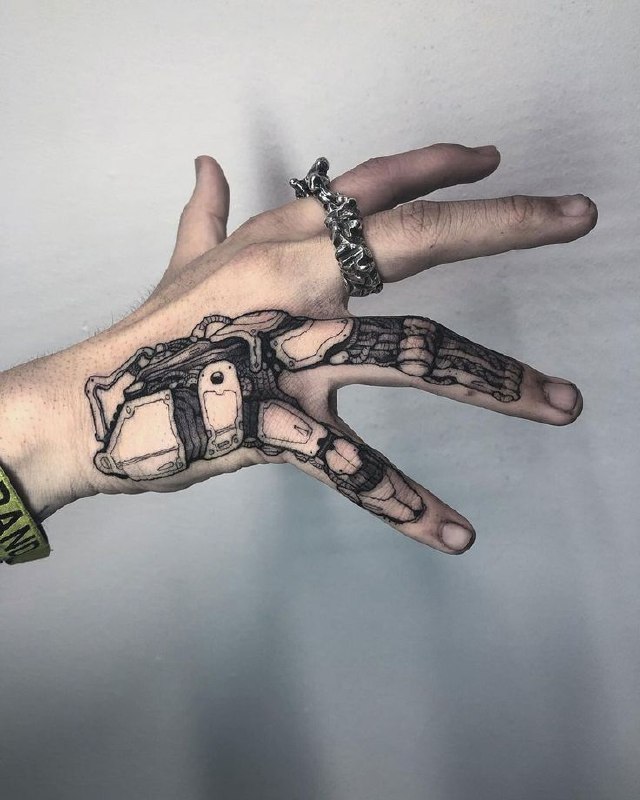 Biomechanics style tattoo on the hand for men