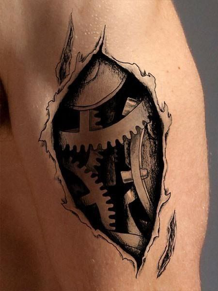 Biomechanics style tattoo on the shin for men