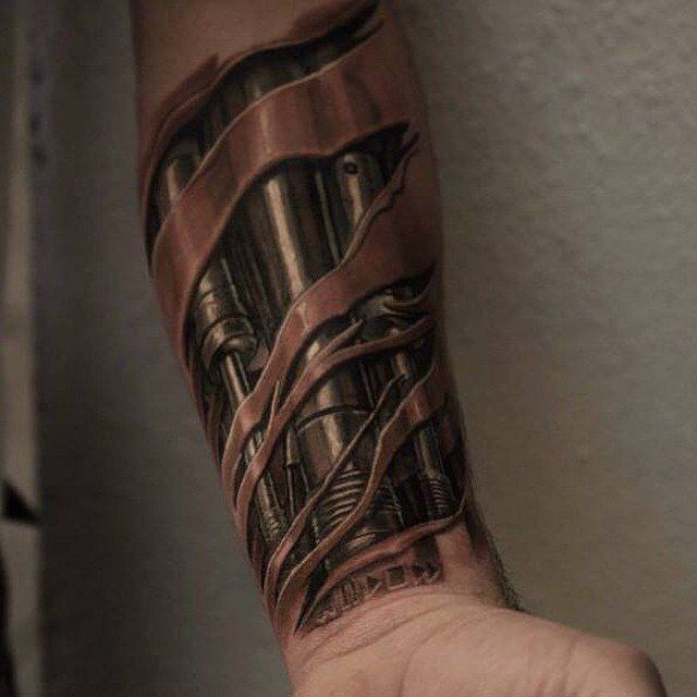 Biomechanics style tattoo on the forearm for men