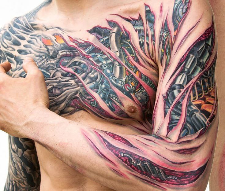 Biomechanics style tattoo on the chest for men