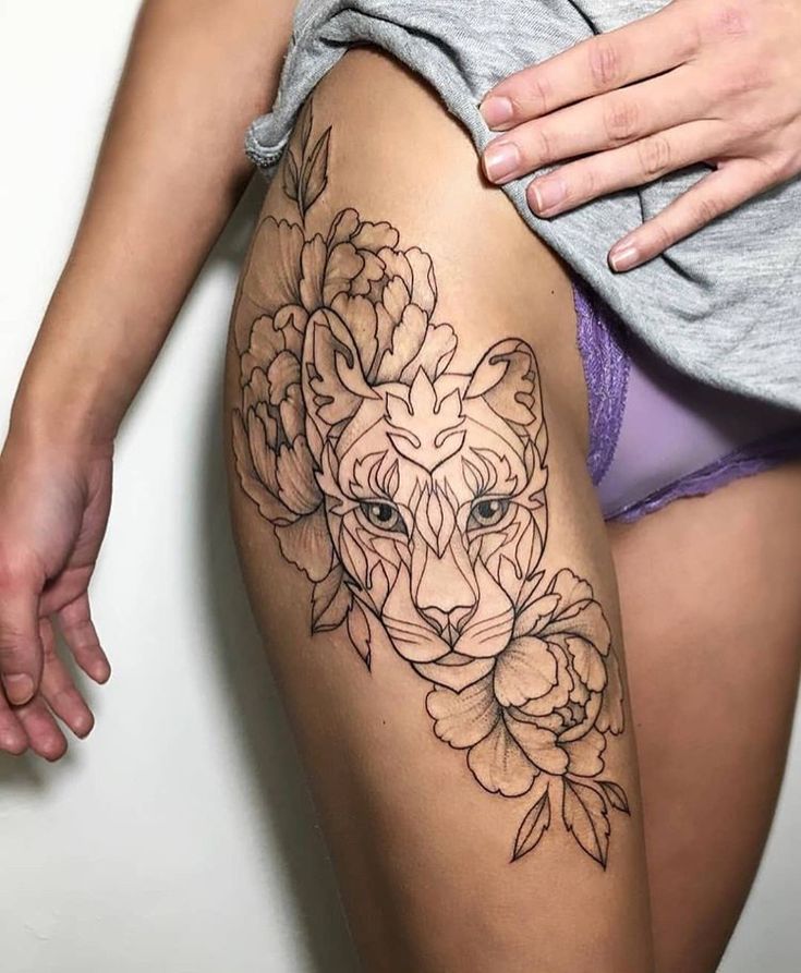 Puma tattoo on the thigh for women