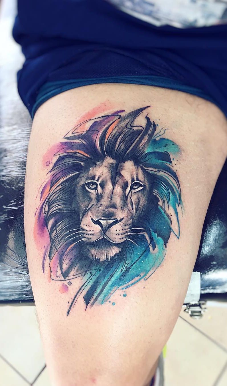 A lion tattoo on the hip for men