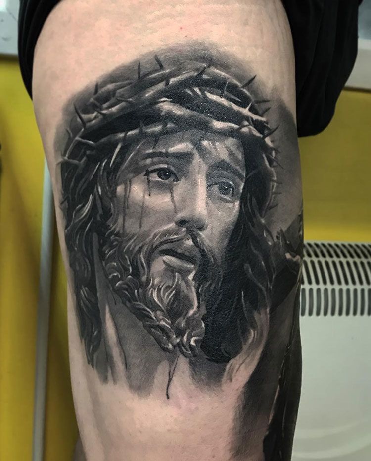 Jesus tattoo on the thigh for men