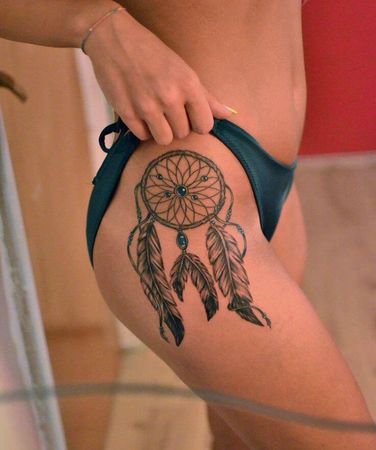 Colorful dream catcher tattoo on the thigh for women