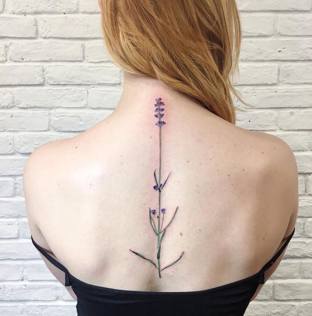 Color tattoo on the spine for women