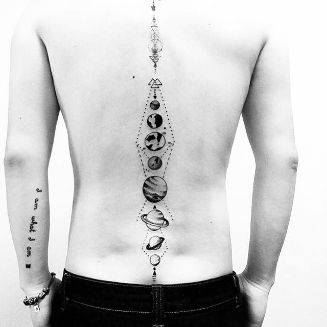 Tattoo of planets on the spine for men