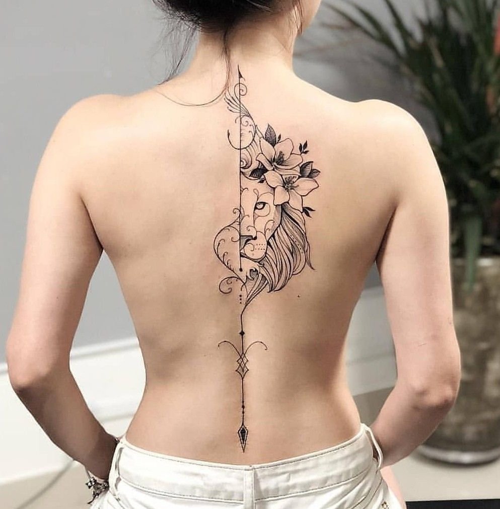 Lion tattoo on the spine for women