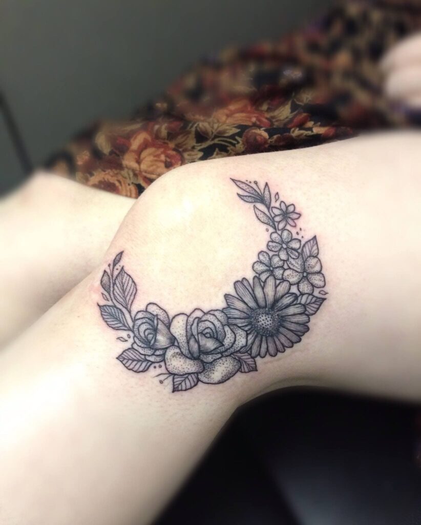 Flower tattoo on the knee for women