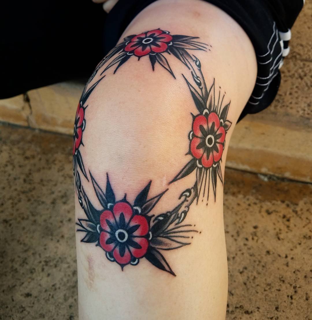 Flower tattoo on the knee for women