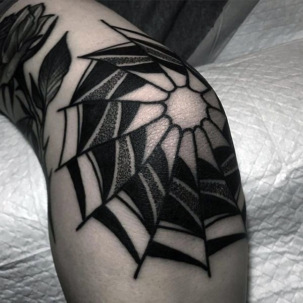 Spider web tattoo on the knee for men