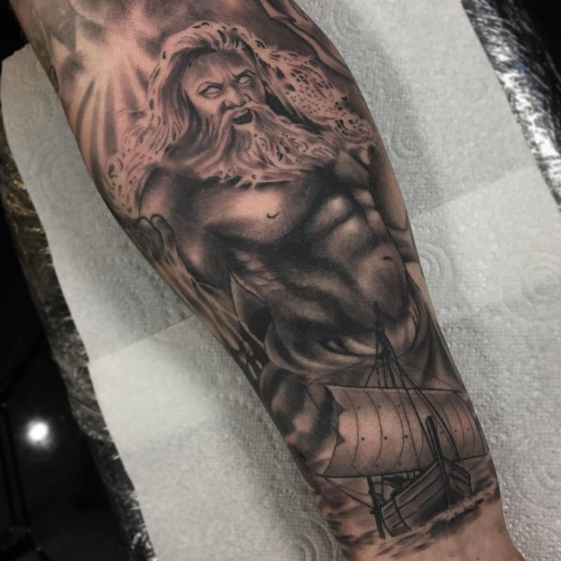 Greek-style tattoo on the forearm for men