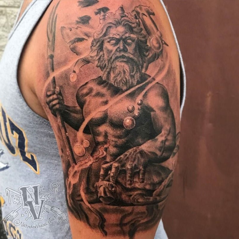 Large Greek-style tattoo on the shoulder for men